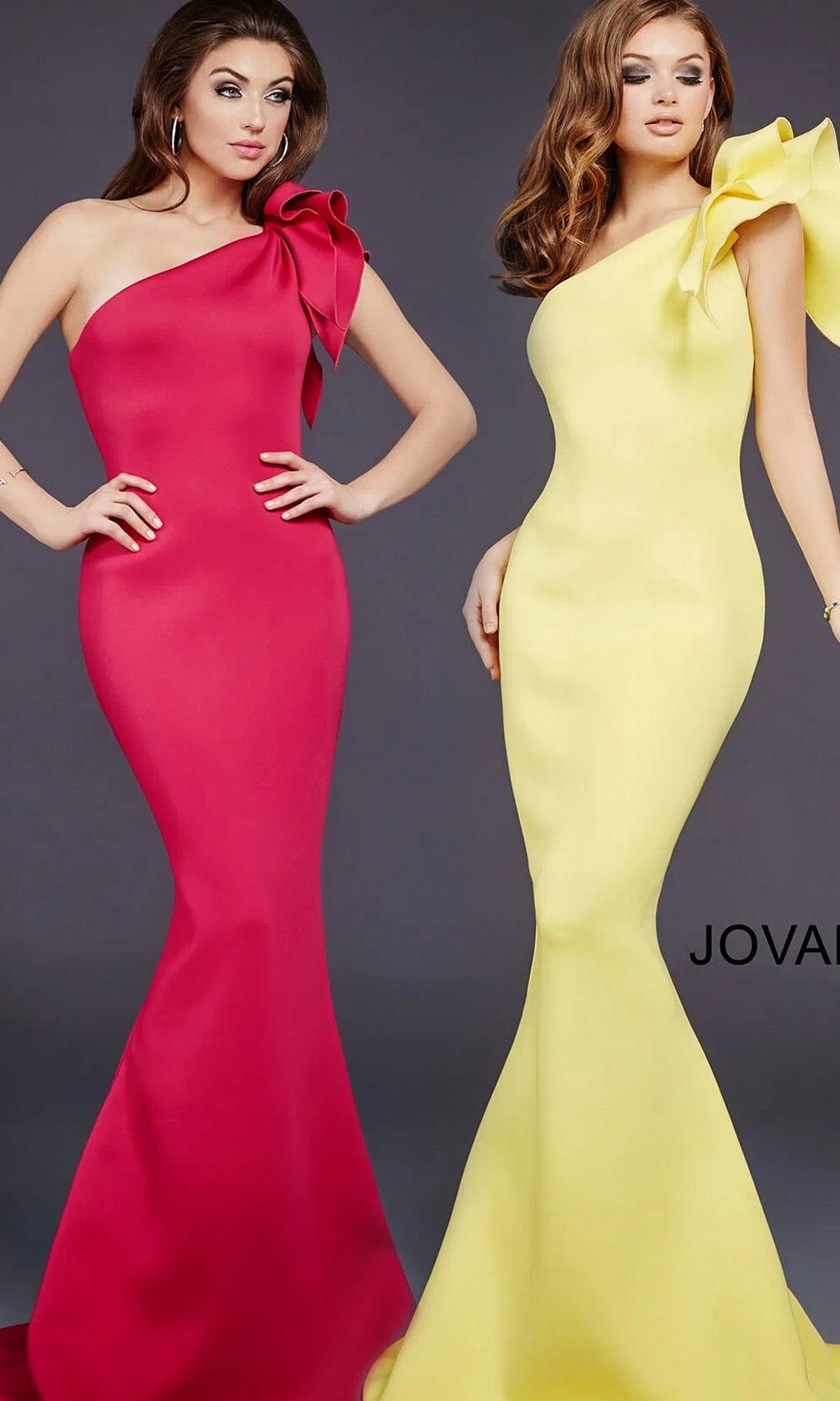 Two women pose against a plain backdrop in Jovani 32602 one-shoulder mermaid prom gowns—one in bright pink, the other yellow—each featuring a dramatic shoulder bow.
